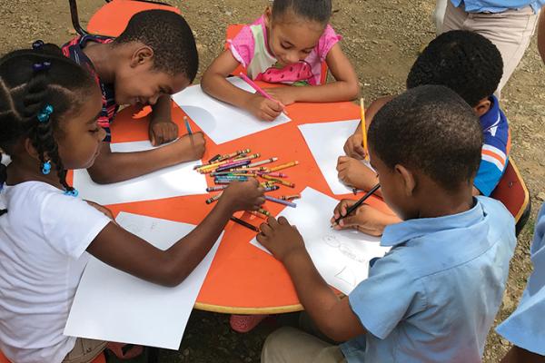 children draw hawks in the Dominican Republic