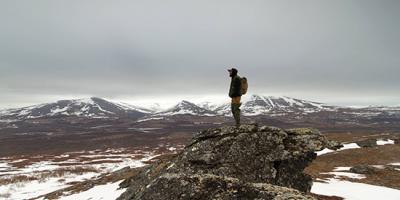 Student overlooks the arctic tundra surveying for gyrfalcons